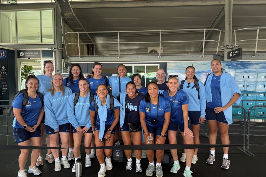 Northern Mystics team members group photo at the downtown Auckland ferry terminal
